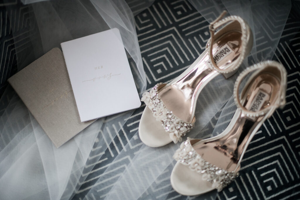 bride wedding shoes, veil and vow books detailed wedding flatlay