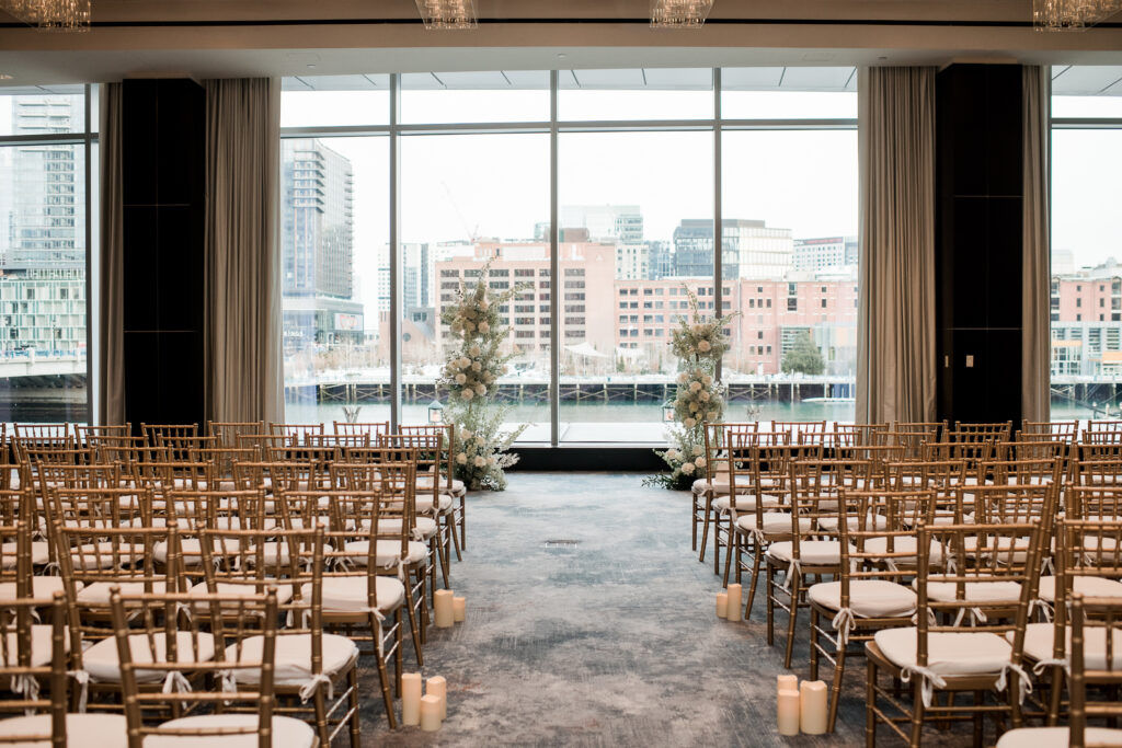 Indoor ceremony boston hotel double floral arches 