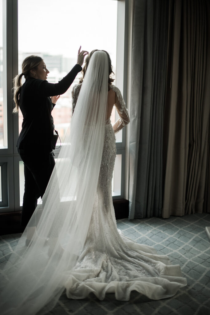 boston luxury wedding planner devyn farias emerald events helping bride on wedding day