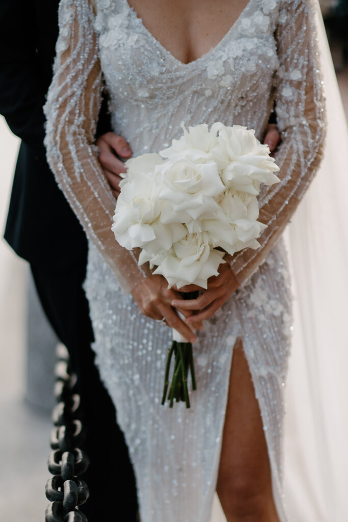 modern brides bouquet of long stem white reflex roses