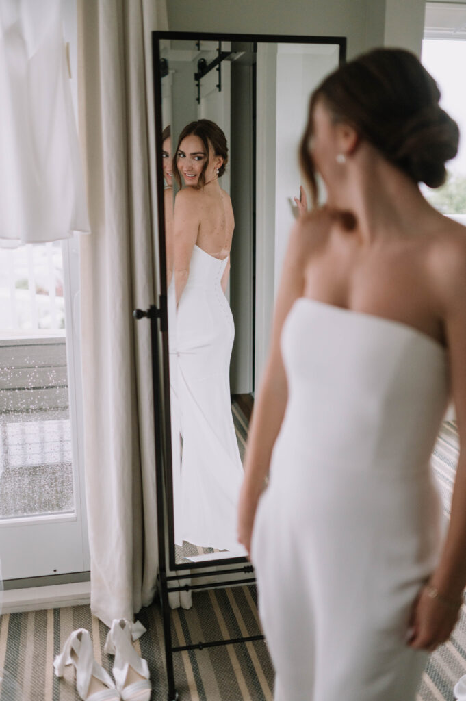 Simple Elegant Strapless White Wedding Gown with Train and Low Back and Buttons Bridal Photo