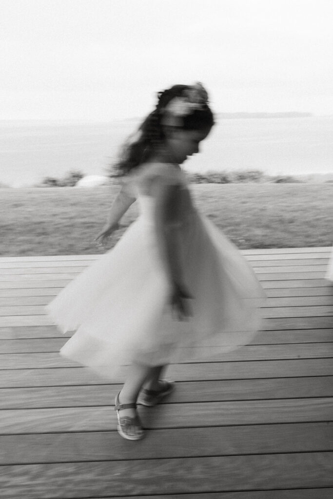 precious flower girl dancing black and white photo 