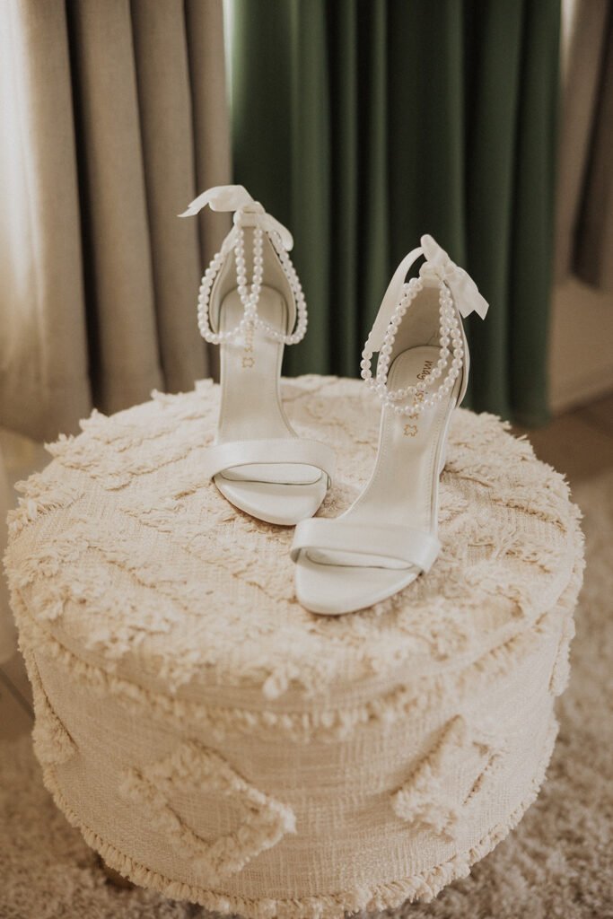 brides white wedding shoes with pearl detailing