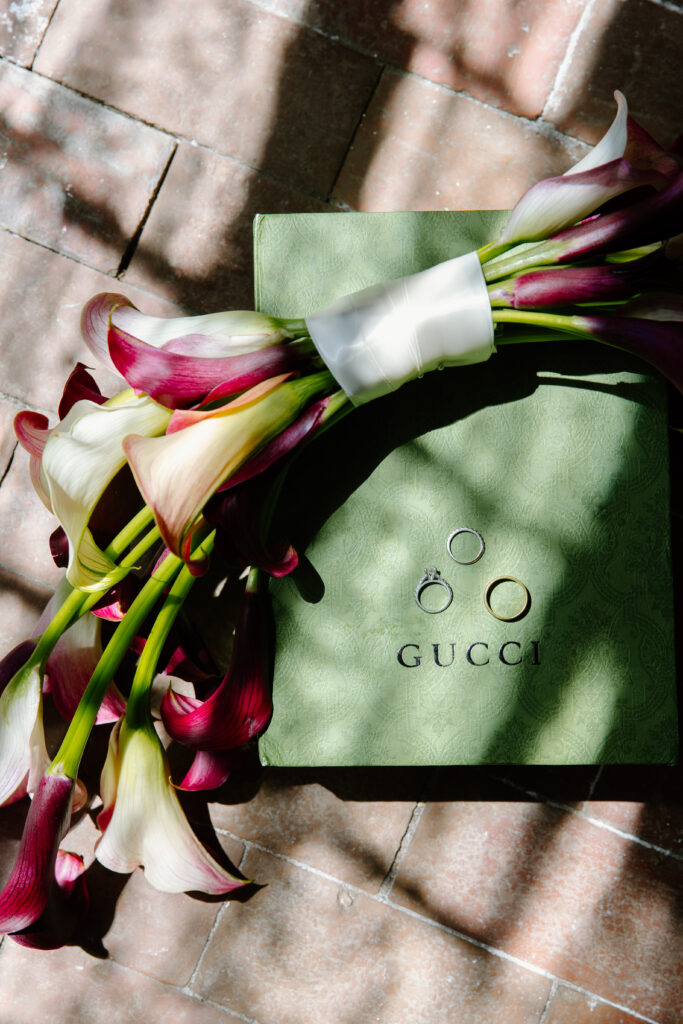 gucci wedding flatlay calla lily bouquet