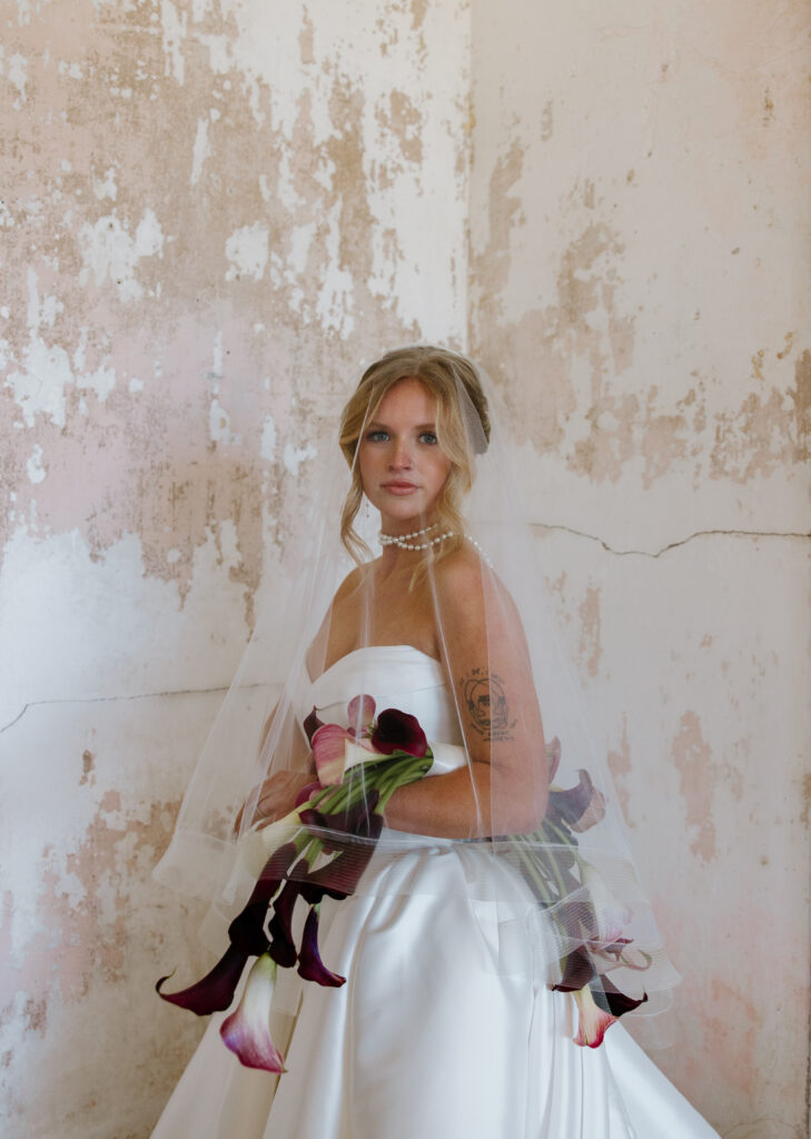 bridal portrait justin alexander signature dress calla lily bouquet