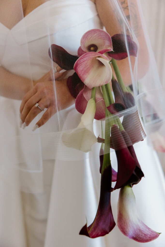 bridal portrait justin alexander signature dress calla lily bouquet